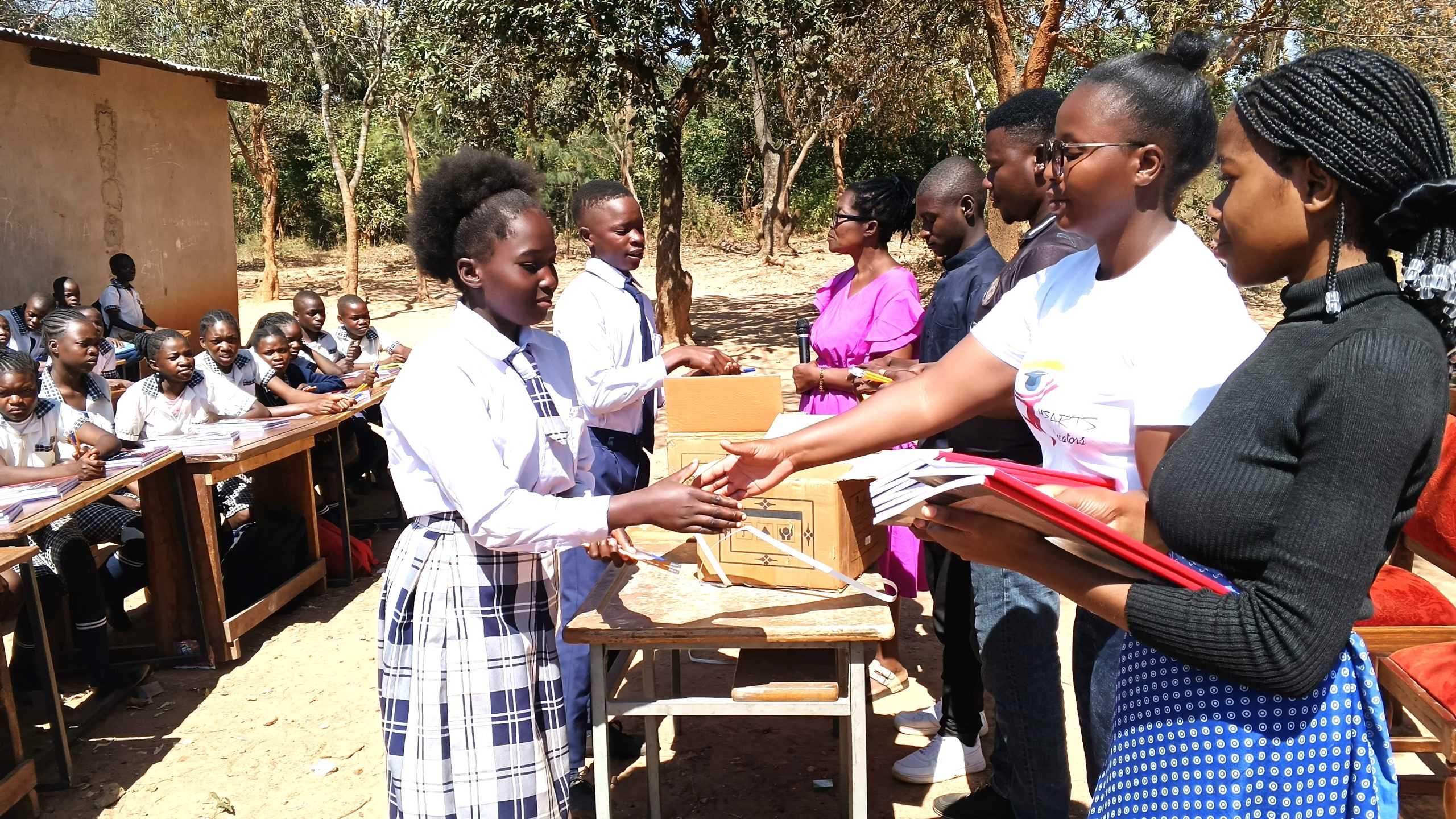 Students receiving educational materials